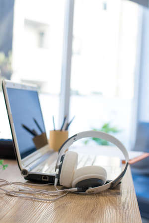 headphones with laptop on the desktop