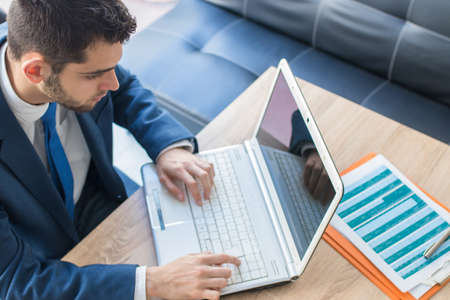 attractive business man with laptop