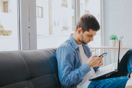 boy with mobile phone at home