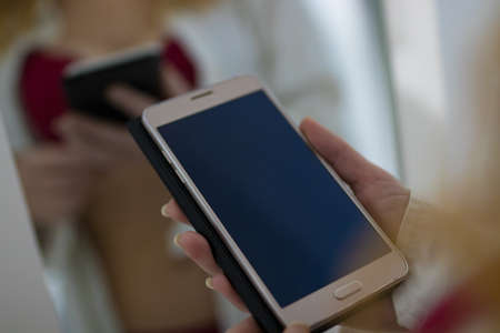 sexy woman with mobile phoneの写真素材