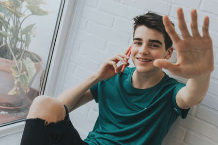 young or teen with mobile phoneの写真素材