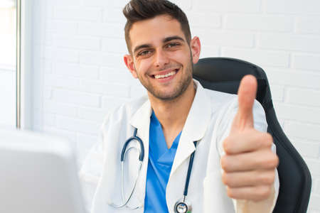doctor smiling with the okay sign or approvalの写真素材