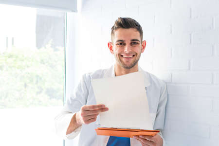 young doctor at the clinic with documents