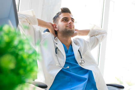 relaxing doctor resting in the consultation or dispatch