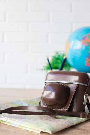 photo camera with map, travel conceptの写真素材