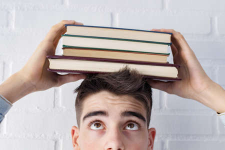 student portrait Looking at the books on the headの写真素材