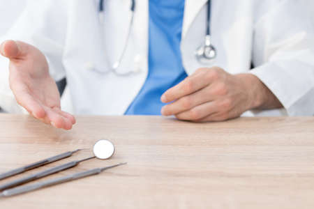dentist with tools and appliances in the clinic