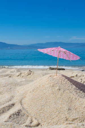 parasol in the sand of the beach, summer and holidaysの写真素材