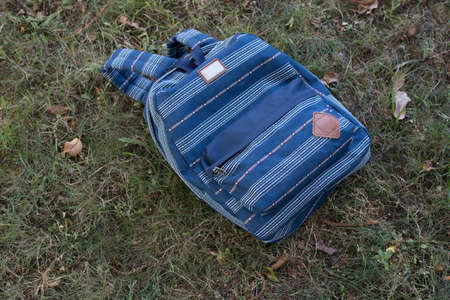 student backpack on campus floor