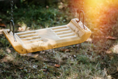 empty old swing in the garden