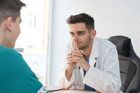 doctor in consultation with patient, health and medicineの写真素材