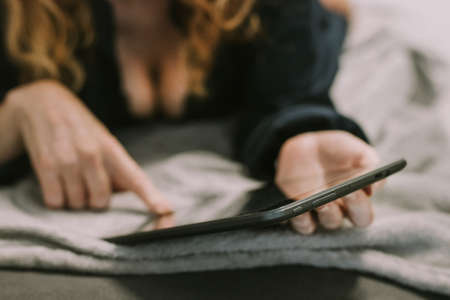 woman with tablet or computer in the home room