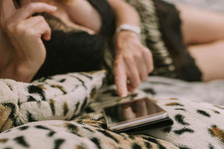 woman in sexy clothes with mobile phone