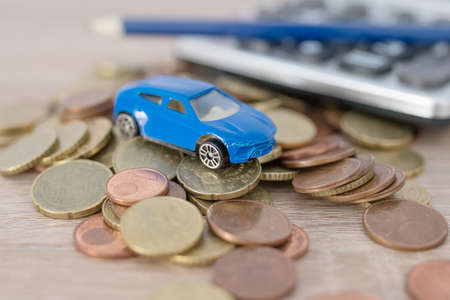 car with coins and calculator, expenses and car purchaseの写真素材