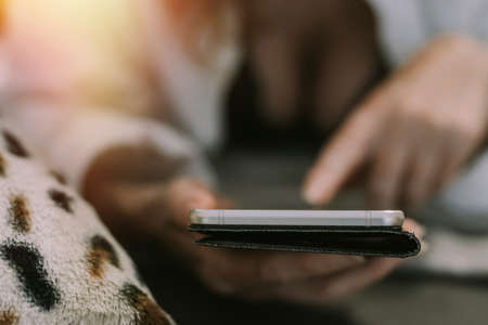 woman at home with cell phone and lingerie