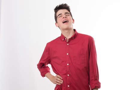 young or teenage boy isolated with pain expressionの写真素材