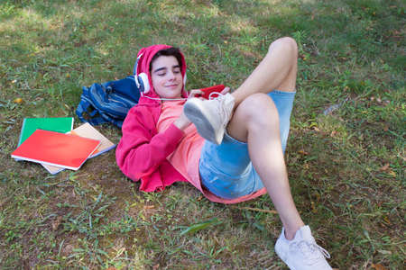 student with books on campusの写真素材