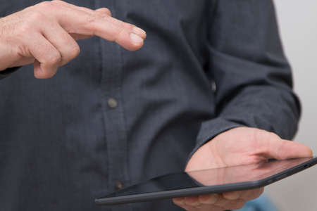 closeup of businessman hands with tablet or digital book