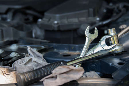 tools on the car engine in the workshopの写真素材