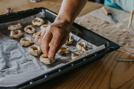 woman making traditional Christmas sweets and dessertsの写真素材