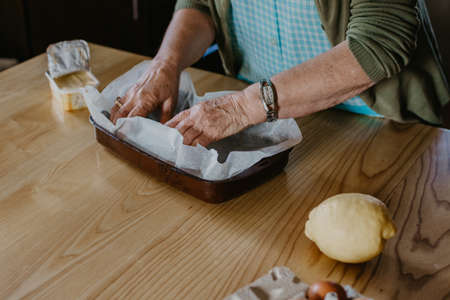 woman in the kitchen making christmas desserts or pastriesの写真素材