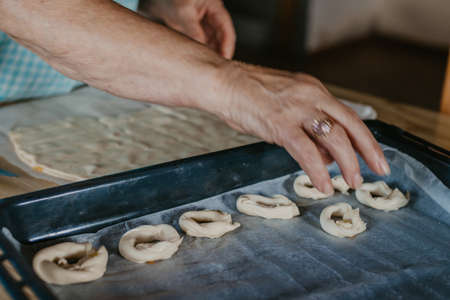 hands cooking making donuts or traditional sweetsの写真素材