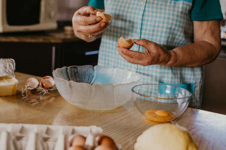 woman hands making desserts or christmas candyの写真素材
