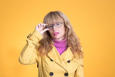 portrait of adult woman with glasses in background