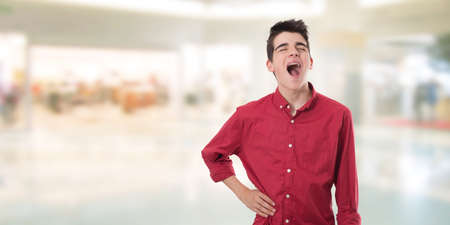 young boy or teenager with gestures or expression of painの写真素材