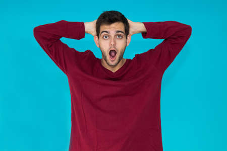 isolated young man with surprise expressionの写真素材