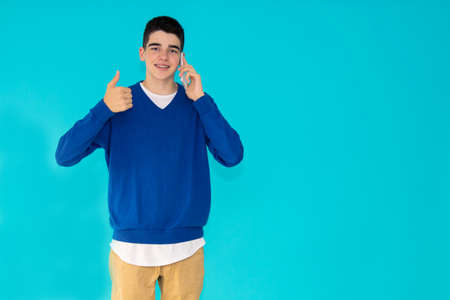 teenage man isolated on color backgroundの写真素材