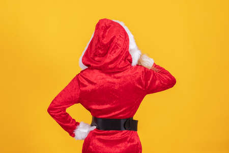 santa claus with mobile phone isolated on color backgroundの写真素材