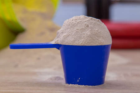 protein or dumbbell powder supplement or gym weights