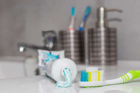 toothpaste tube and toothbrush in the bathroom