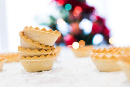 sweets and cakes with christmas tree backgroundの写真素材