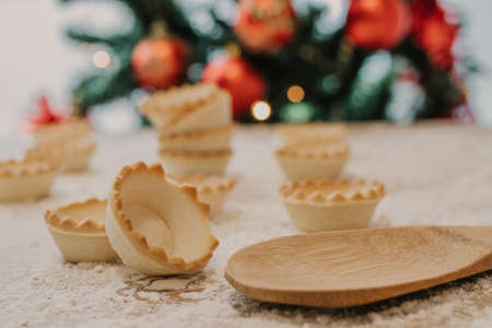 sweets and cakes with christmas tree backgroundの写真素材