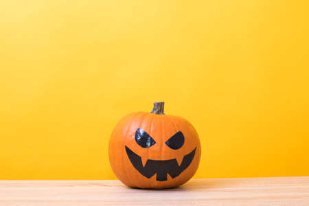 halloween pumpkins in color backgroundの写真素材