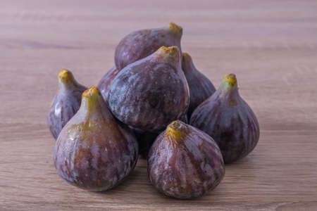 natural black figs grouped in wood