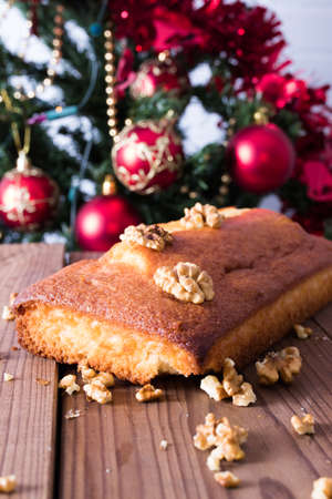 christmas cake with nuts and ornamentsの写真素材