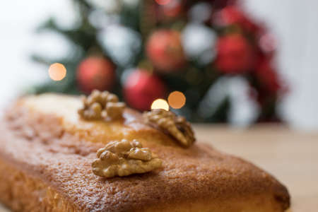 christmas cake with nuts and ornamentsの写真素材