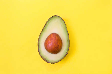 open natural avocado isolated on color backgroundの写真素材