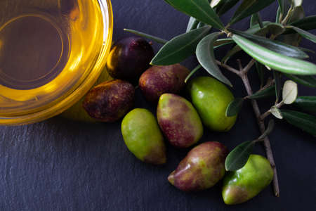 fresh natural olives on black backgroundの写真素材