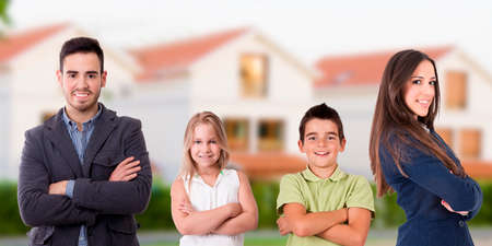 smiling young family of parents and childrenの写真素材