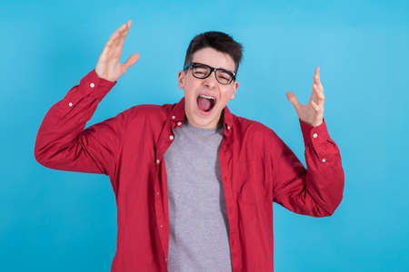 young teenage man isolated on color background
