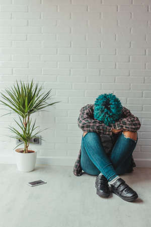 young girl at home distressed or lonelinessの写真素材