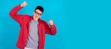 trendy young teen boy or student in urban fashion isolated on color background with space for text...