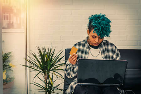 woman with credit card and laptop buying onlineの写真素材