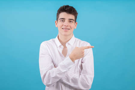 portrait of teenager or male student isolated on color backgroundの写真素材