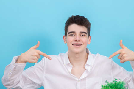 portrait of young teenager man or student isolated on color backgroundの写真素材