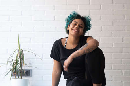 athlete woman doing gymnastic exercises or stretching at home or gymの写真素材